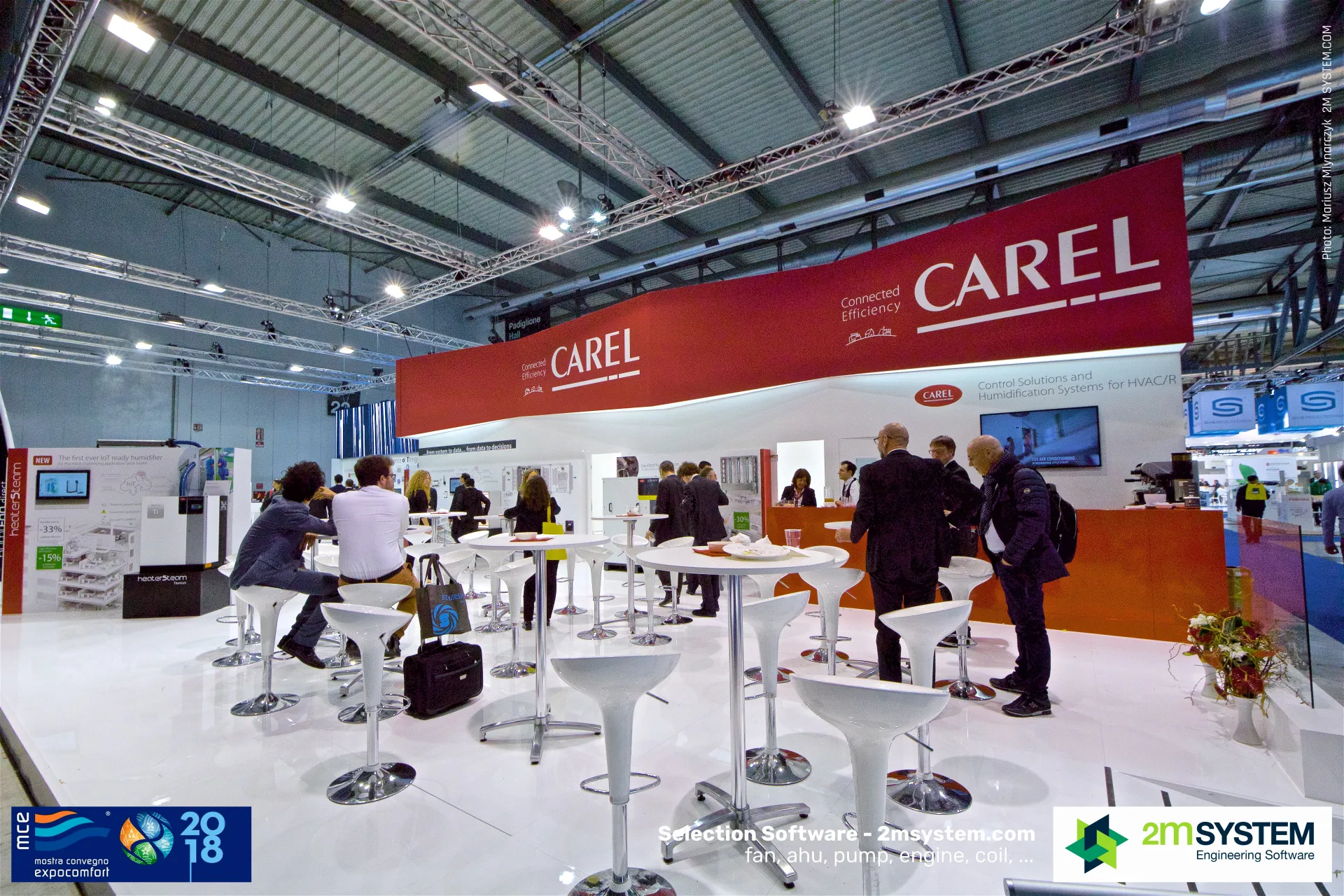 Carel hospitality bar with orange counter and white stools at MCE 2018