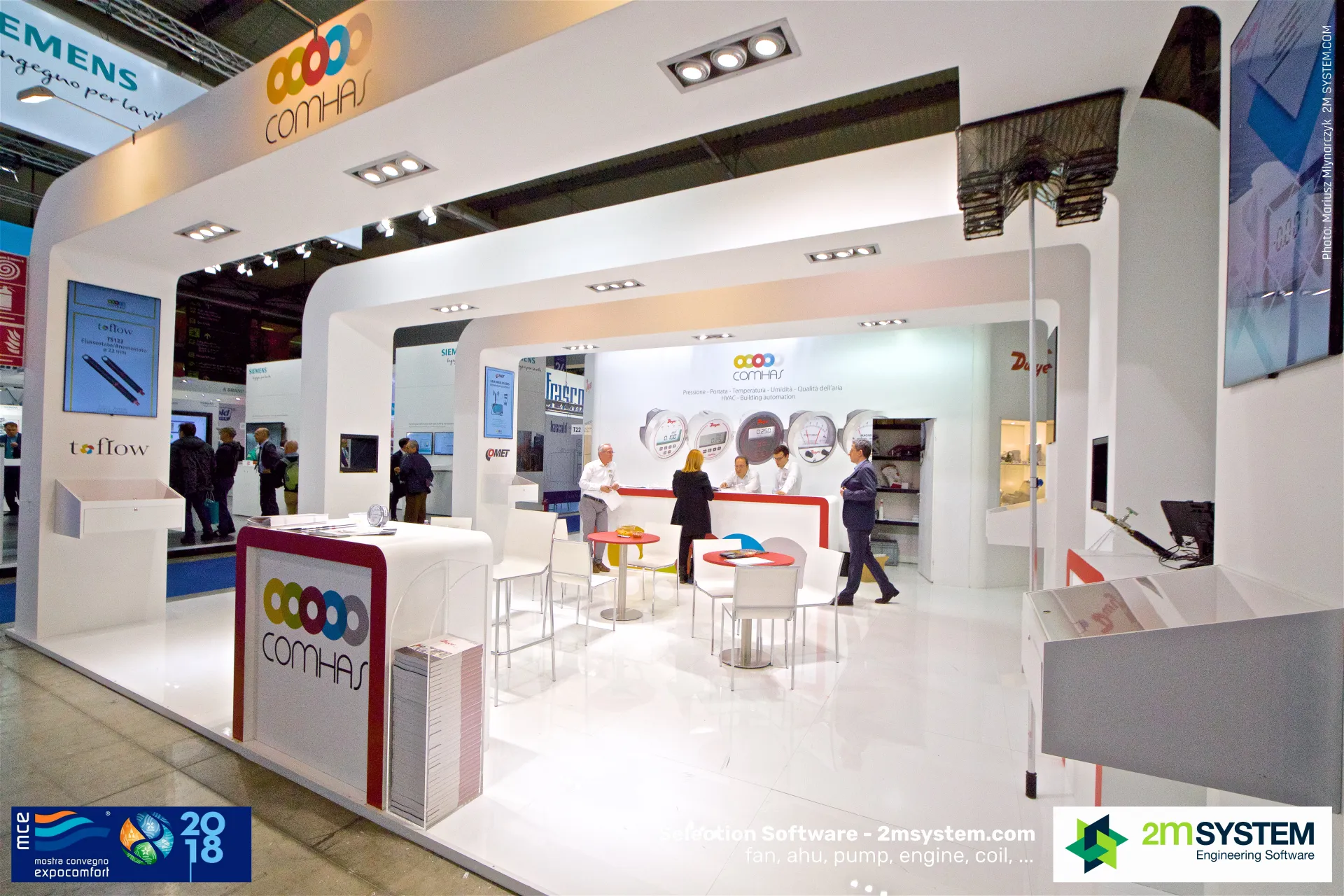 Comhas stand with toflow flow sensor display and Dwyer gauge wall at MCE 2018
