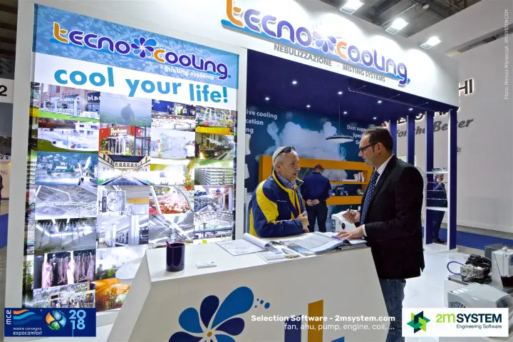 Conversation at the Tecno Cooling counter beside the misting application collage