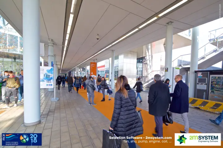 Covered walkway with orange carpet linking halls during MCE 2018