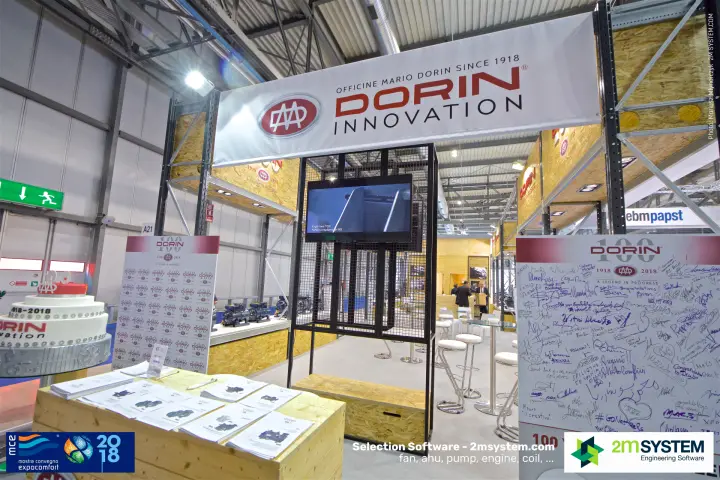 Dorin centenary entrance with anniversary cake and a signed greetings wall at MCE 2018