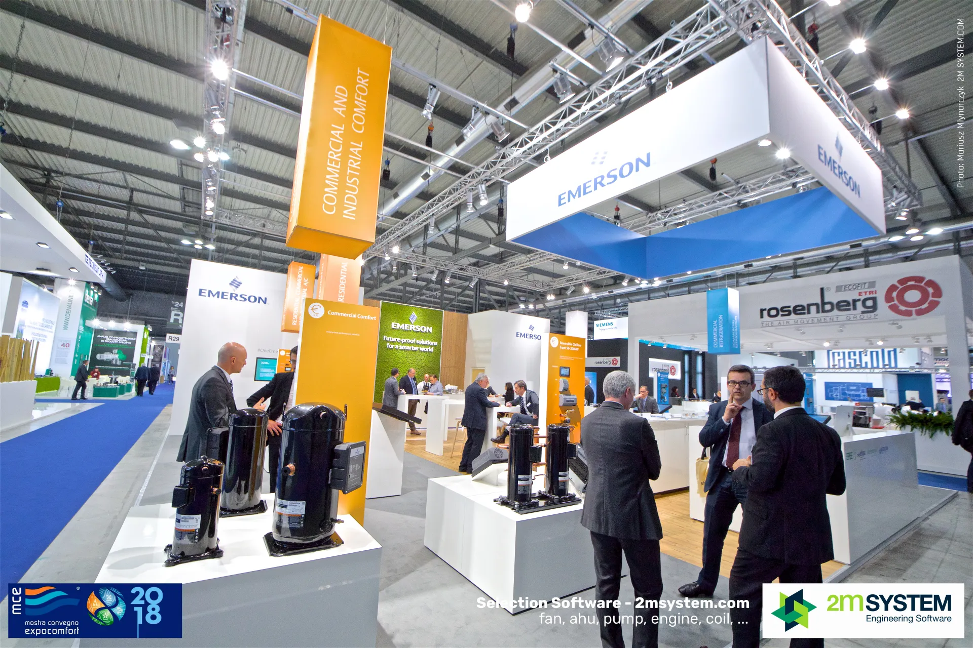 Emerson stand with scroll compressors on white plinths and orange hanging banners at MCE 2018