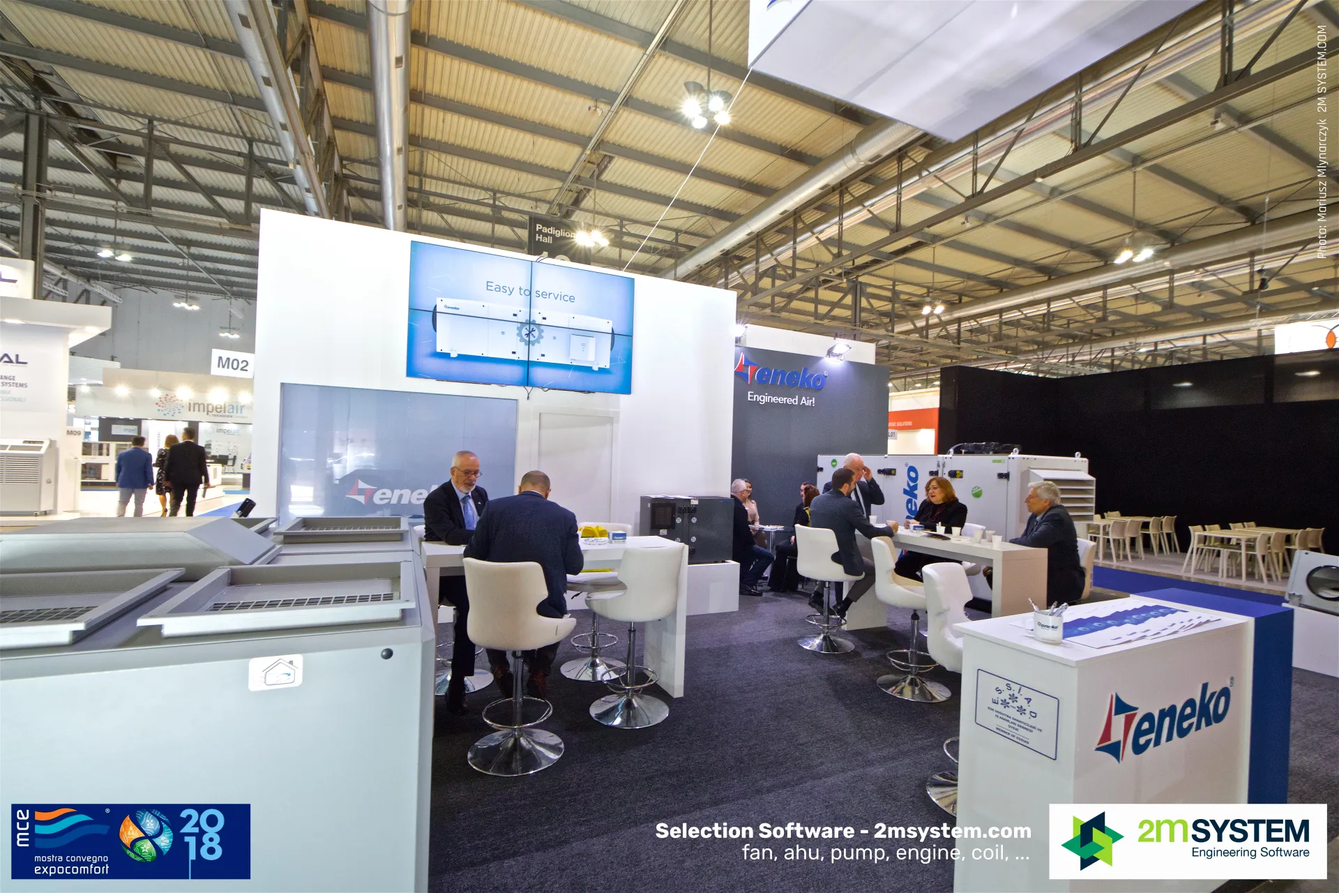 Eneko video wall showing 'Easy to service' above meeting tables at MCE 2018
