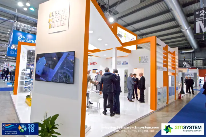 Euro Motors Italia stand with orange frames and greeting visitors at MCE 2018