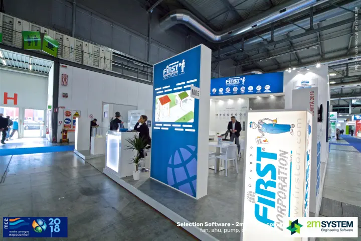 First Corporation stand corner with backlit 'Gruppo First' column