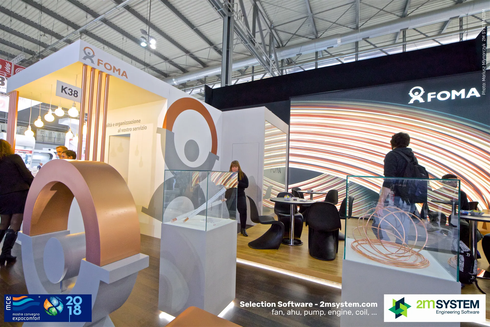 FOMA copper logo sculpture beside a showcase of copper coils at MCE 2018