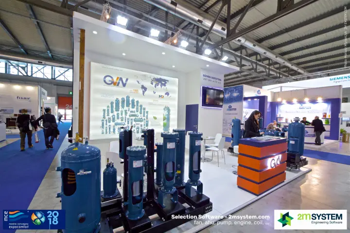 GVN stand with liquid receivers and oil separators in front of a lit wall