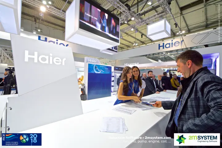 Haier reception counter with staff serving a visitor under a video cube