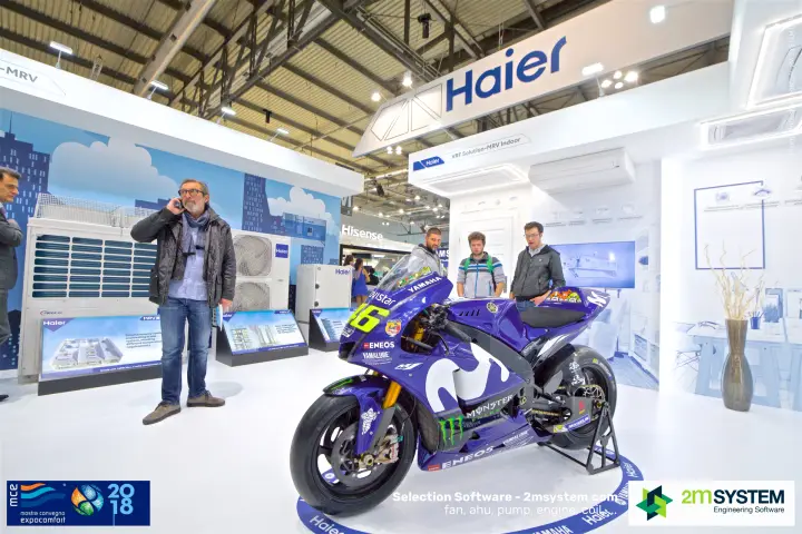 Haier VRF stand with a Yamaha racing motorcycle among MRV outdoor units at MCE 2018