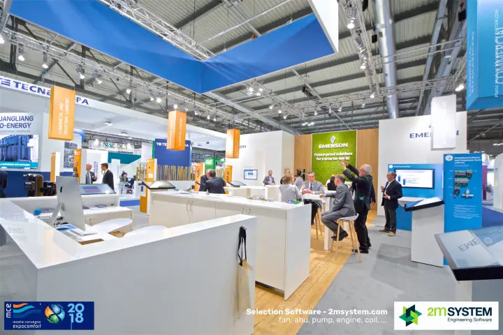 Inside the Emerson stand: touchscreen kiosks, meeting tables and moss logo wall at MCE 2018
