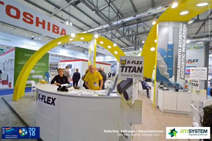 K-Flex reception counter under yellow arch with Titan launch signage at MCE 2018
