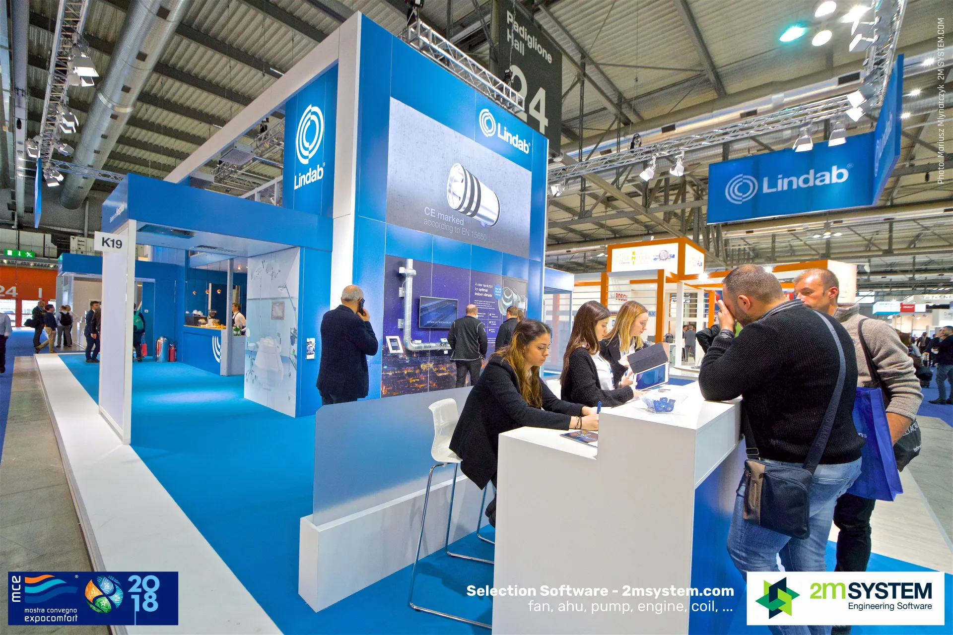 Lindab stand K19 with a CE-marked damper graphic and reception desk at MCE 2018