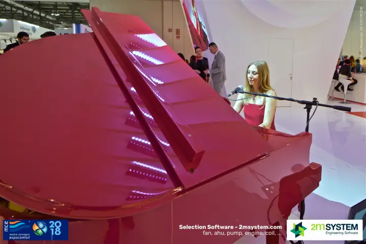 Live piano performance on a red grand piano at Mitsubishi Electric at MCE 2018