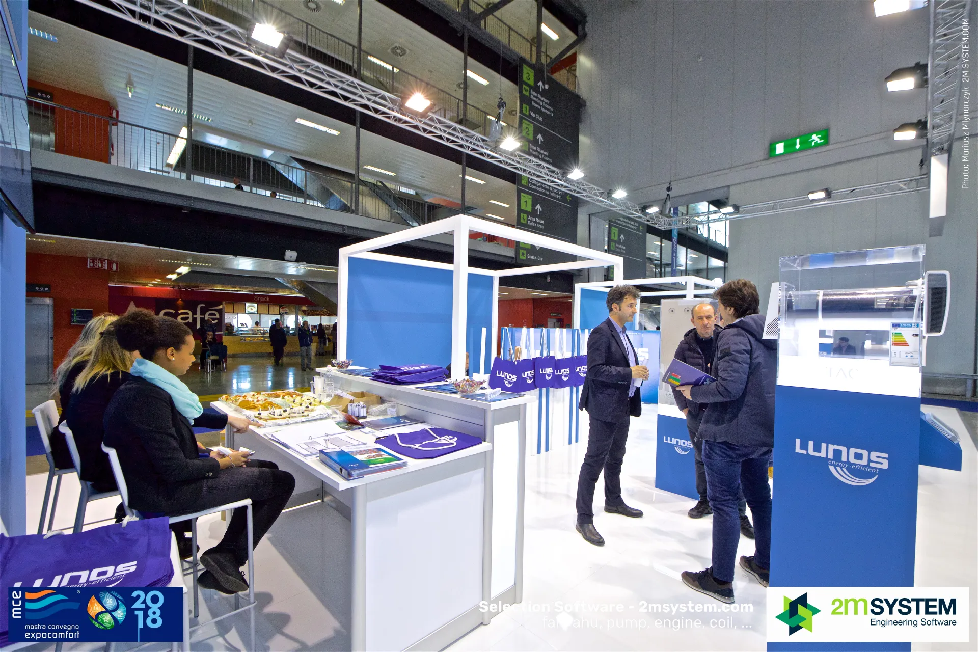 Lunos stand desk with brochures and branded bags at MCE 2018
