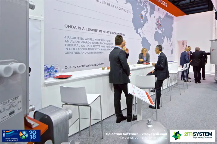 Meeting at the Onda counter with ISO 9001 quality wall text at MCE 2018