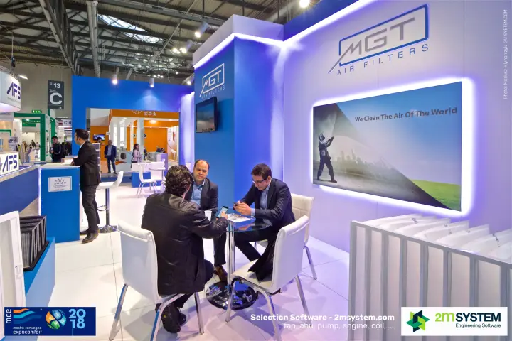 Meeting table at MGT Air Filters under the slogan "We Clean The Air Of The World"