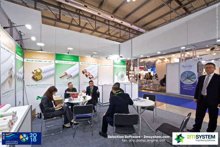 Meetings at Tatsukin tables beside the pre-insulated pipe posters