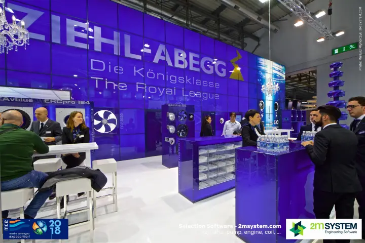 Meetings at Ziehl-Abegg bar tables under 'The Royal League' wall at MCE 2018