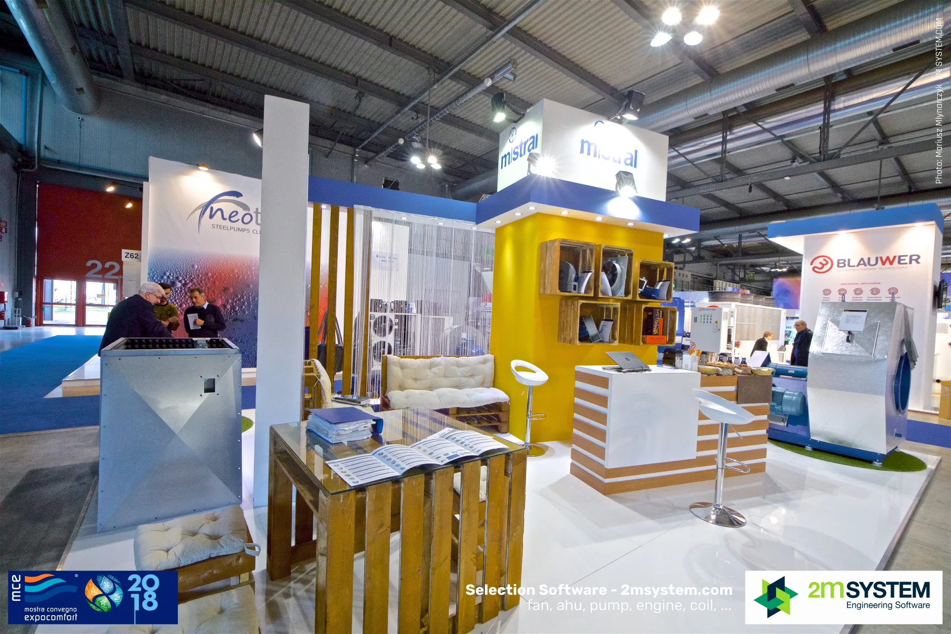Mistral lounge with pallet furniture and fan models in wooden crates at MCE 2018