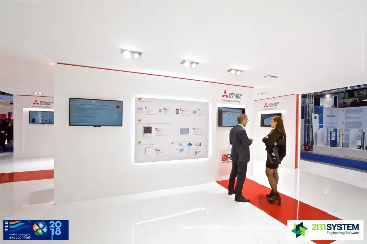 Mitsubishi Electric controls display with screens and RMI remote monitoring logo