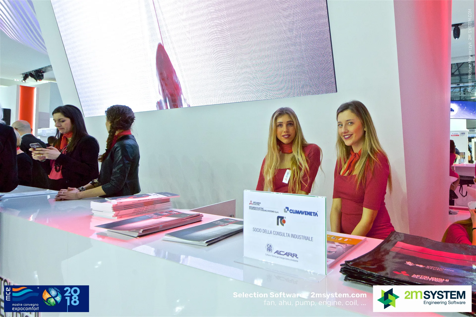 Mitsubishi Electric front desk with AiCARR membership sign and brochures at MCE 2018
