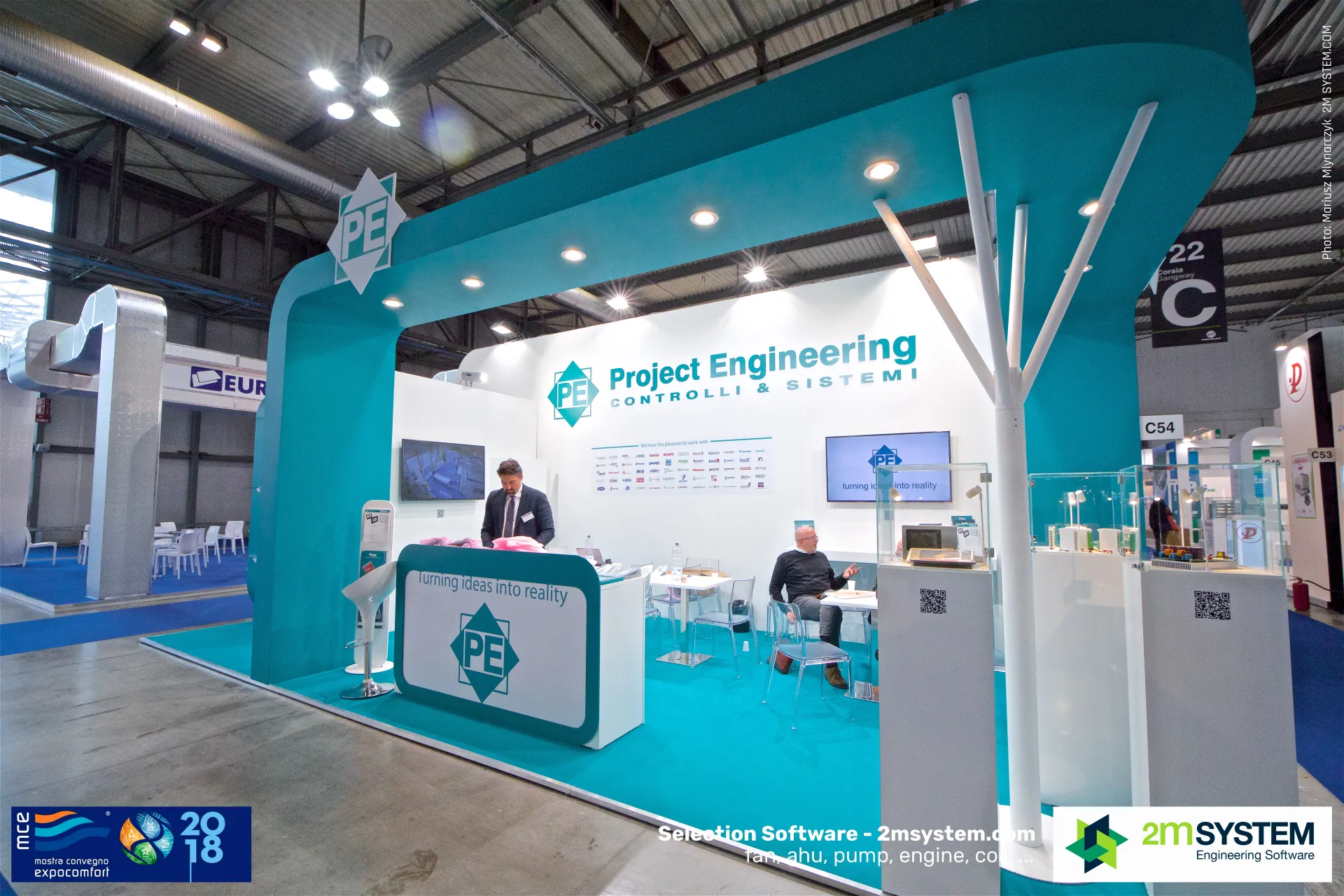 Project Engineering teal stand with control boards in glass showcases at MCE 2018