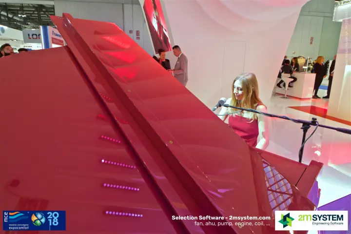 Red grand piano lid with LED reflections during the stand performance at MCE 2018