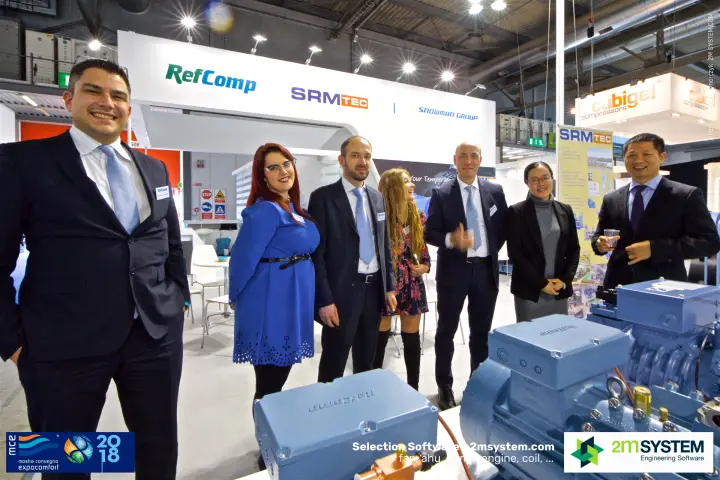 RefComp team with an embossed compressor terminal box in front at MCE 2018