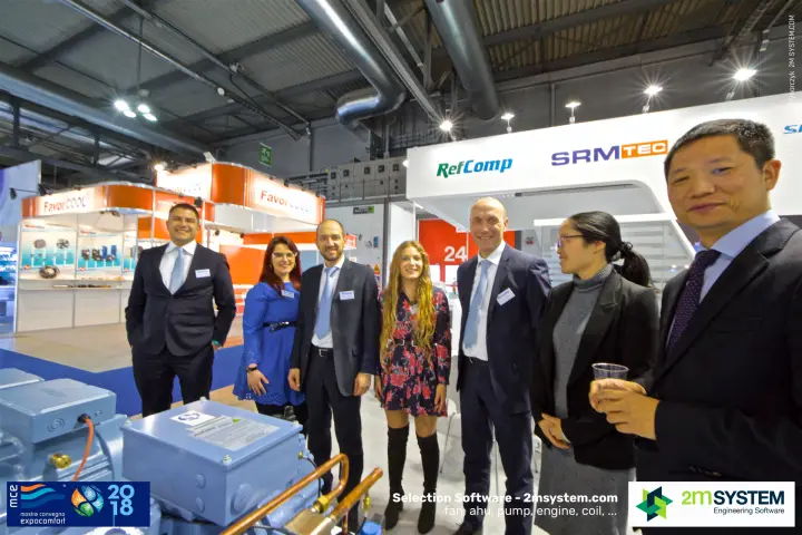 RefComp team portrait with FavorCool stand across the aisle at MCE 2018