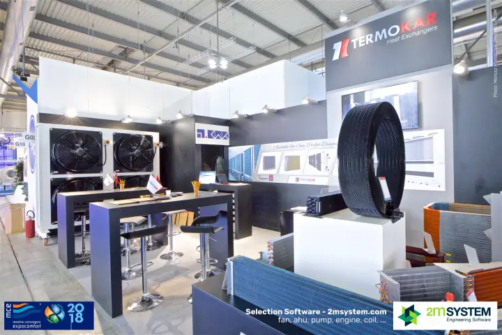 Round black-coated coil on a plinth at the Termokar stand