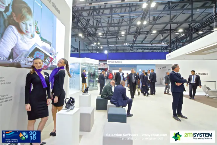 Samsung hostesses by the LED wall and VR area, Office Building zone behind at MCE 2018
