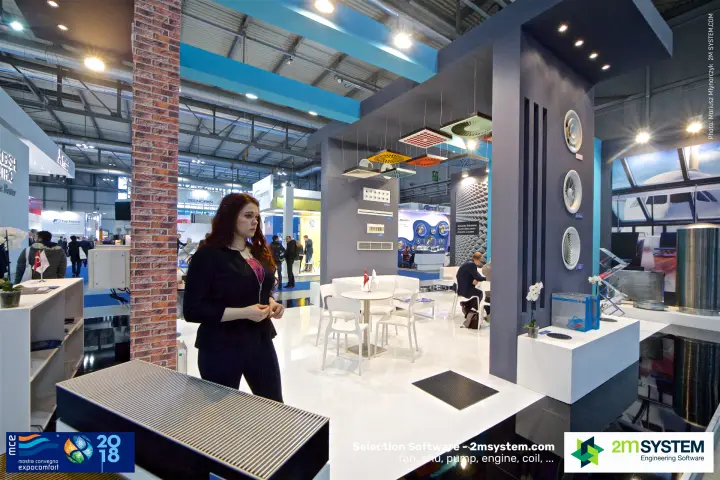 Staff member beside a floor convector at Elektroteknik