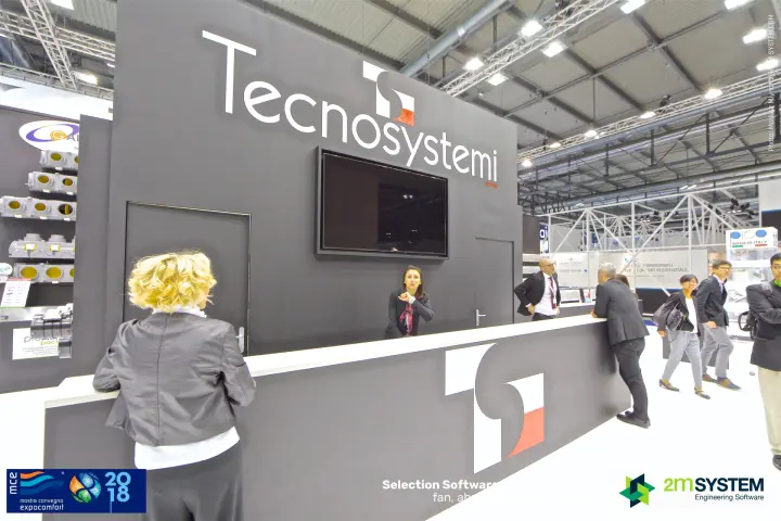 Tecnosystemi reception desk under the large white group logo at MCE 2018
