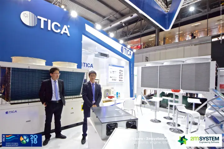 TICA staff beside a modular air-cooled unit and ventilation box
