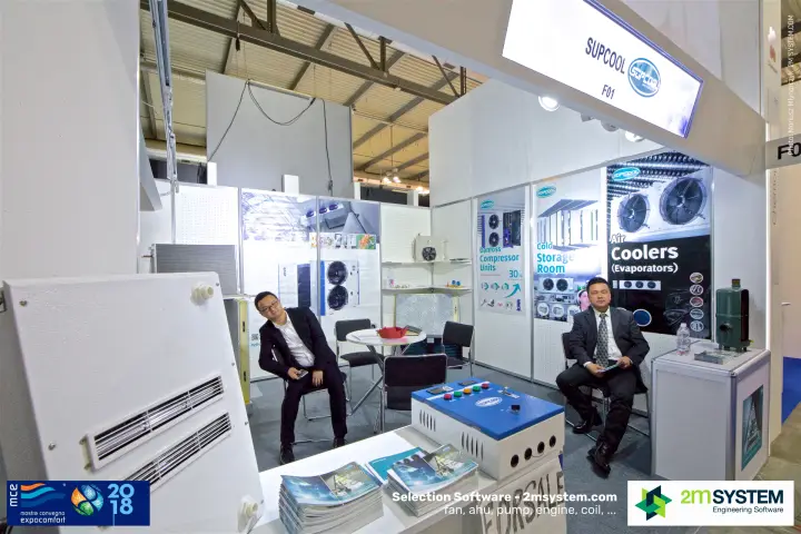 Two staff members seated at the Supcool refrigeration booth
