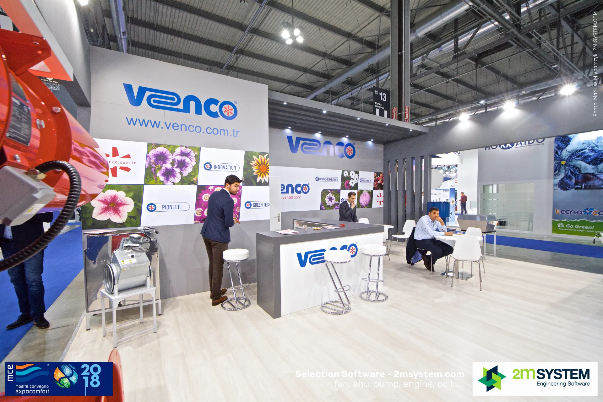 Venco stand framed by a red fan housing in the foreground at MCE 2018