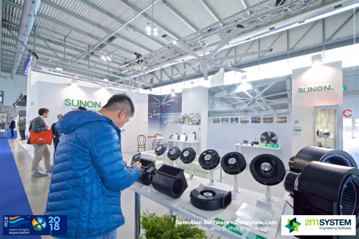 Visitor photographing Sunon EC centrifugal fans under an HVLS ceiling fan at MCE 2018
