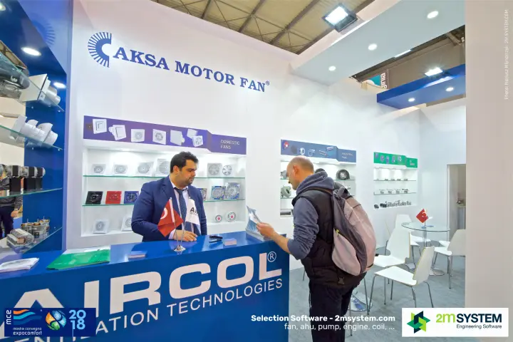 Visitor reading a brochure at the Aircol counter of Aksa Motor Fan