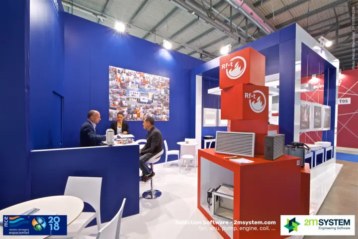 Visitors at the ADM counter beside the red Rf-t display cubes