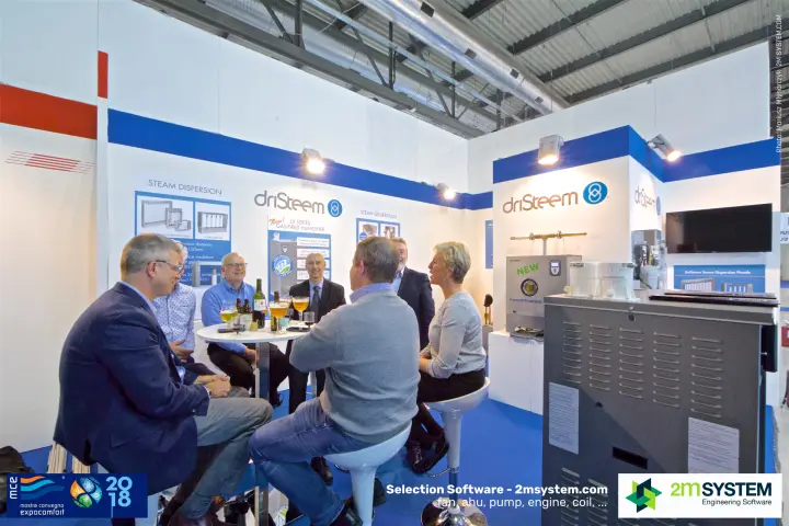 Visitors in conversation at the DriSteem stand with humidifier displays at MCE 2018