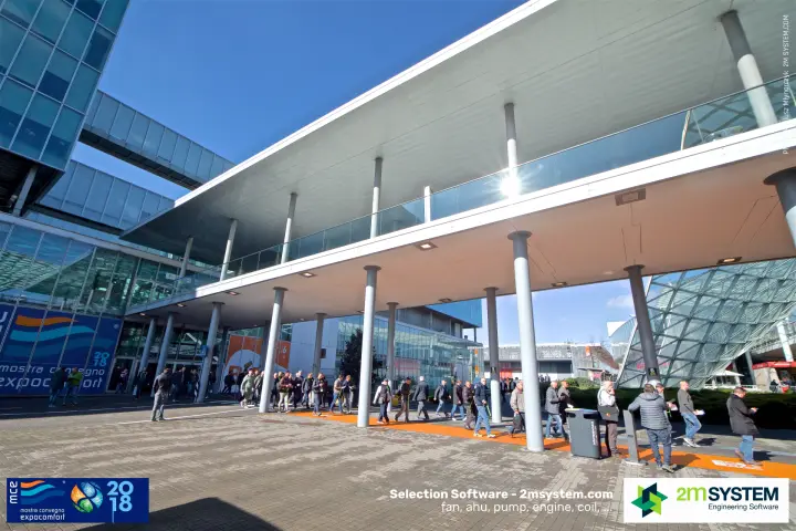 Visitors crossing under the elevated walkway by the MCE-branded hall at MCE 2018