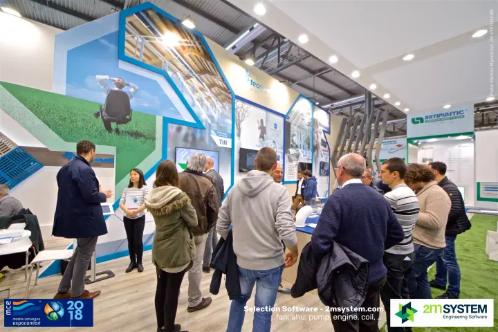 Visitors crowd the Tecno-Ventil stand during a product talk