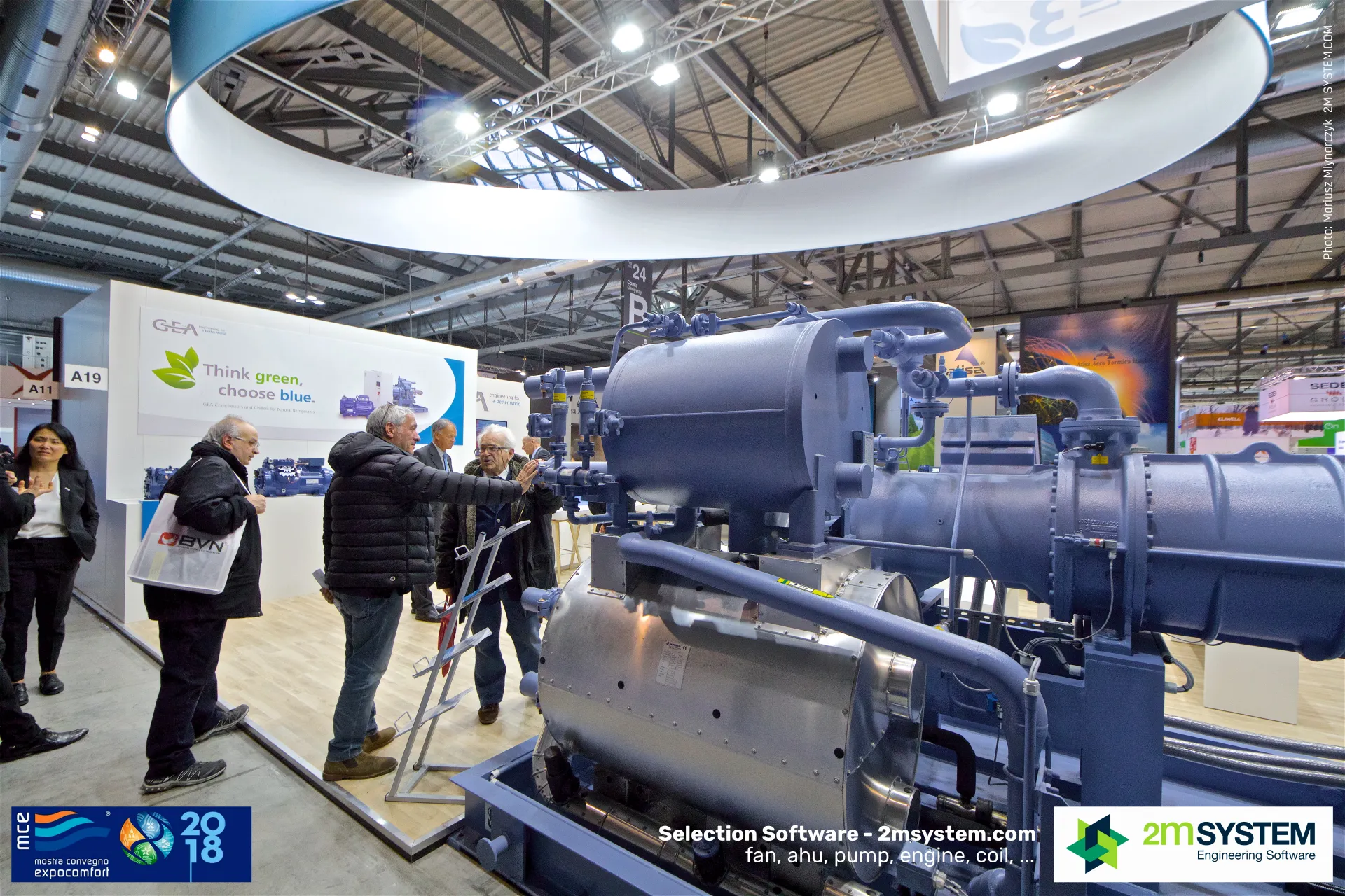 Visitors discussing a large GEA compressor package at MCE 2018