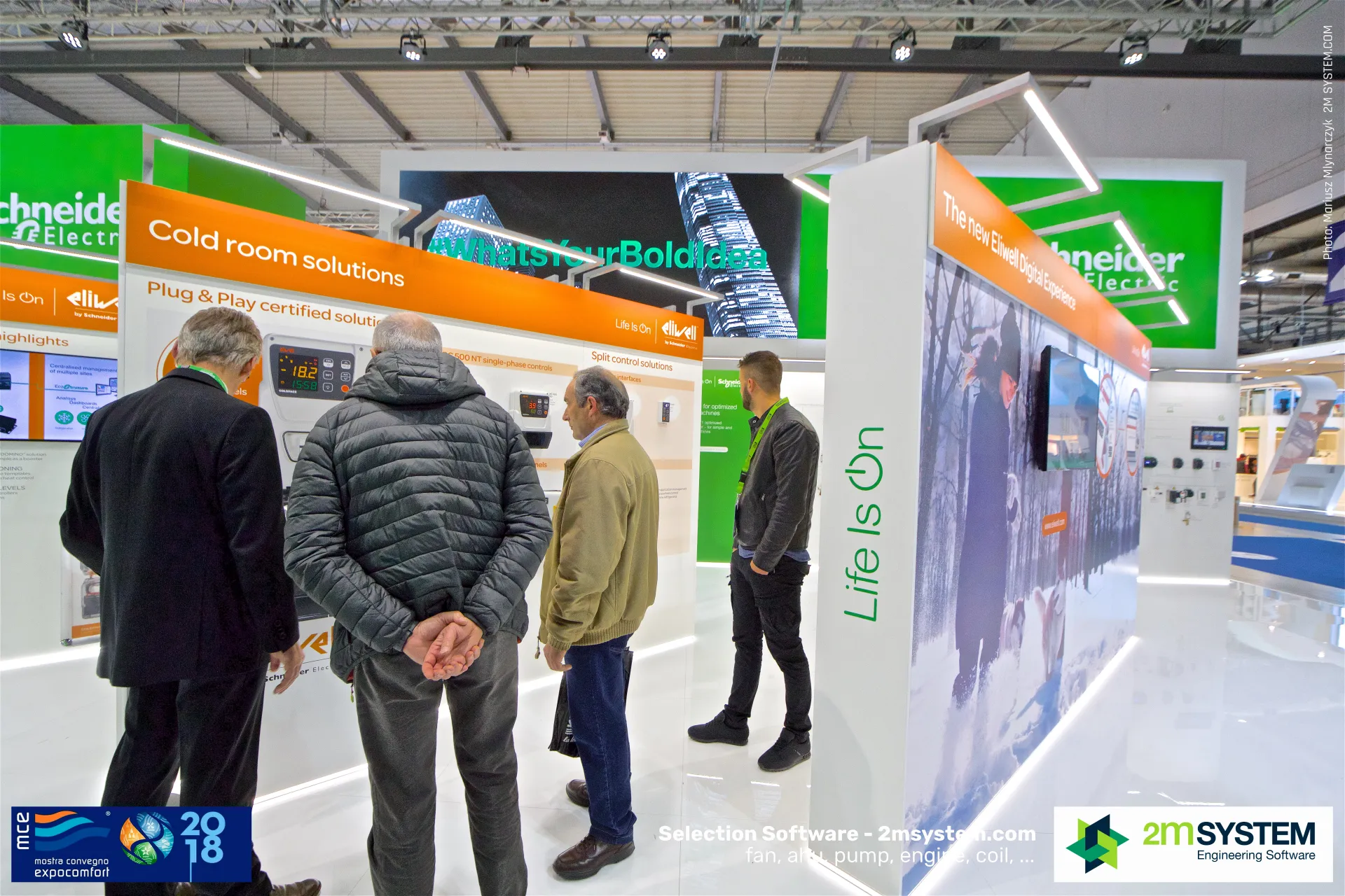 Visitors at the Eliwell cold room solutions panel with digital controllers at MCE 2018