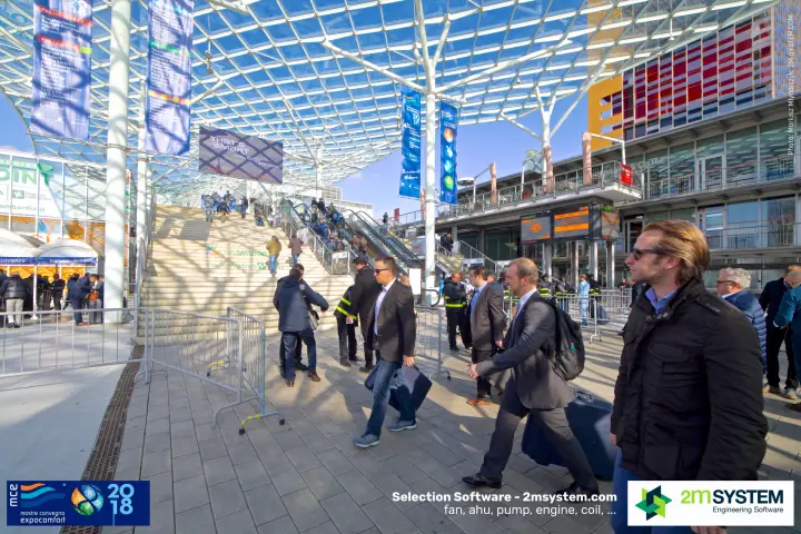 Visitors heading to the main staircase under the glass canopy at Fiera Milano at MCE 2018