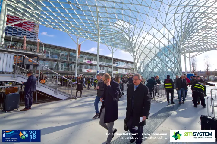 Visitors passing security staff under the lattice canopy at the entrance at MCE 2018