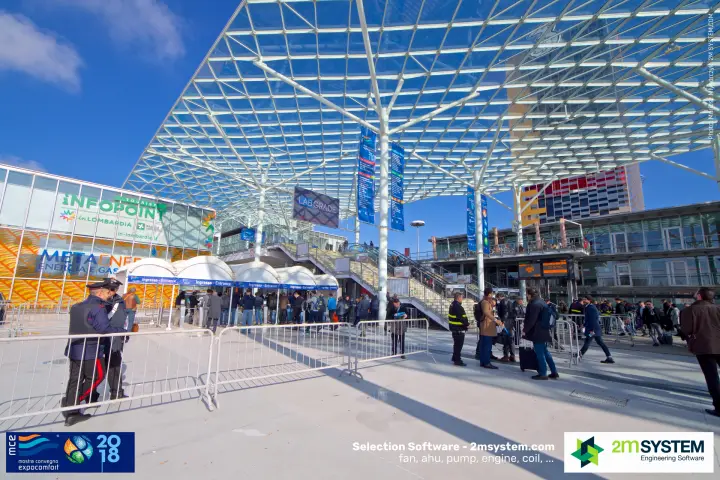 Visitors queuing at the 'Ingresso - Entrance' gates beside the Infopoint at MCE 2018