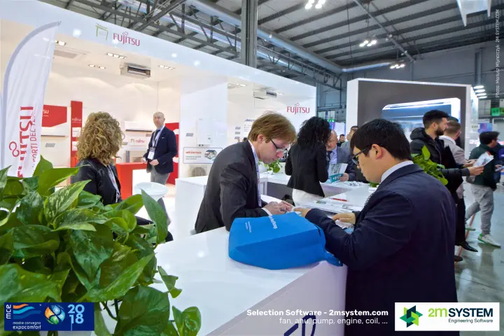 Visitors register at the Fujitsu stand reception desk at MCE 2018
