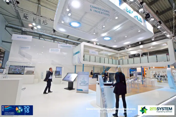 Visitors at Sanhua touchscreen kiosks below the upper deck at MCE 2018