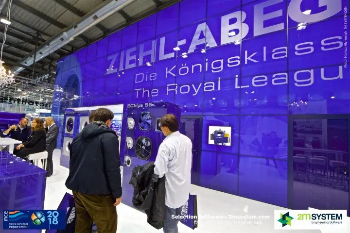 Visitors studying the ECblue 55 fan display at Ziehl-Abegg
